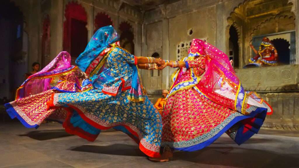 " Rajasthani Kalbelia women showcasing traditional cultural activity with vibrant costumes and graceful dance movements."