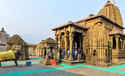 "Tourists praying in Baijnath Temple during Uttarakhand tour"