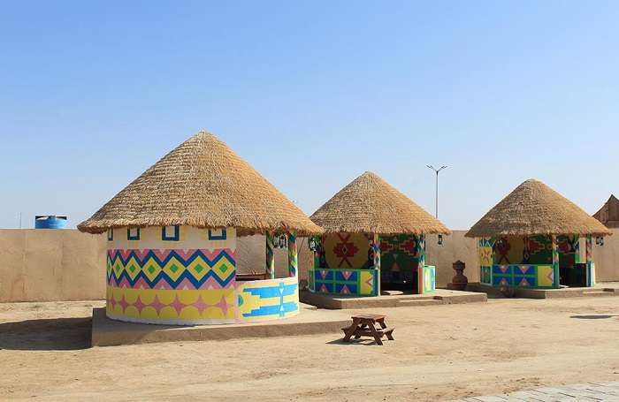 Kutch village hats - Colorful traditional houses with unique architecture showcasing vibrant cultural heritage and craftsmanship of rural Gujarat."