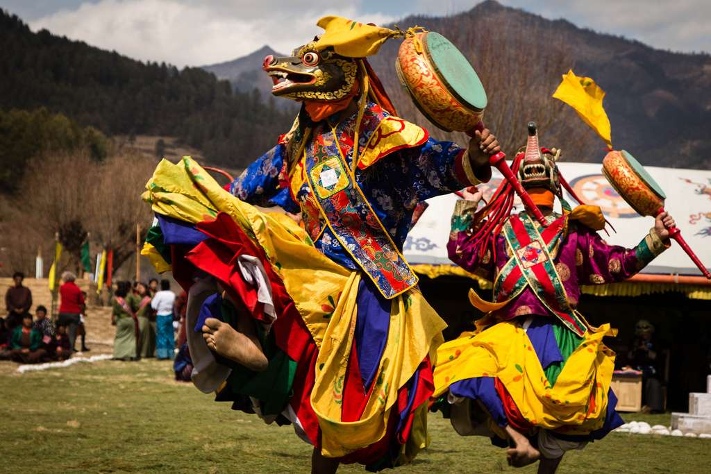 Bhutanese cultural dance with traditional costumes - A captivating performance showcasing the rich cultural heritage of Bhutan through vibrant dance movements and colorful traditional attire."