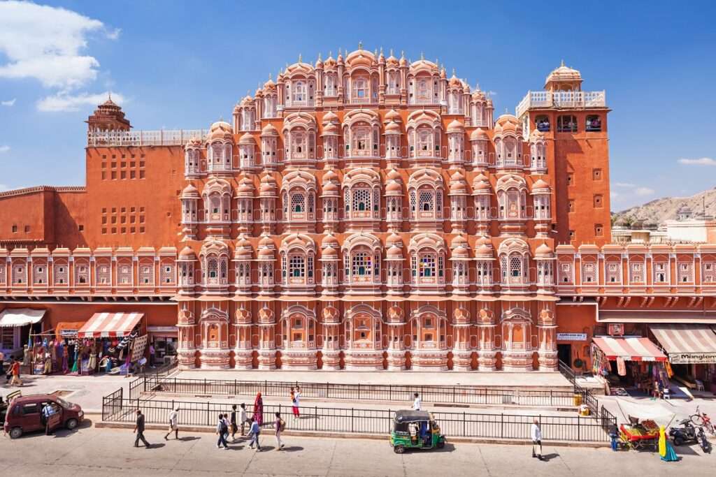 "Hawa Mahal Palace, Jaipur - Iconic Pink Sandstone Architecture with Intricate Lattice Work and Windows"