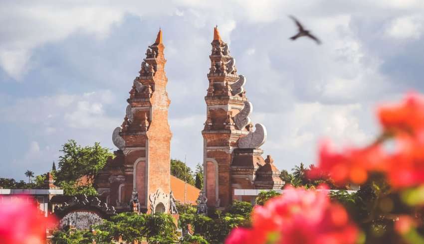 "The Taman Ayun Temple in Bali is a beautiful Hindu temple surrounded by lush gardens and water features."