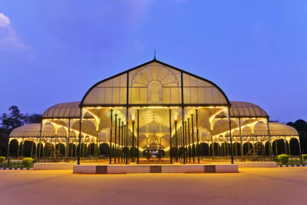 "Lalbagh Botanical Garden in Bangalore glowing in the night, showcasing its stunning landscapes and vibrant colors, offering a serene and magical experience."