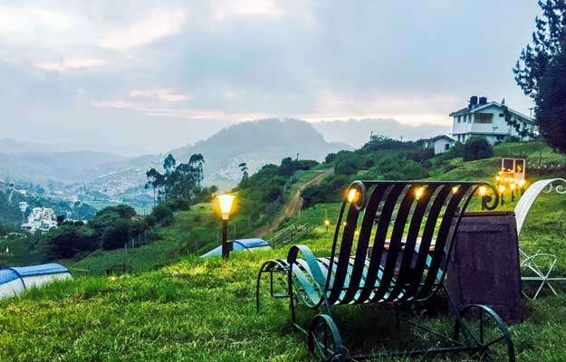 "Idyllic South Indian nature retreat with lush green landscapes and rolling hills, offering the perfect opportunity to unwind and relax amidst pristine natural beauty."