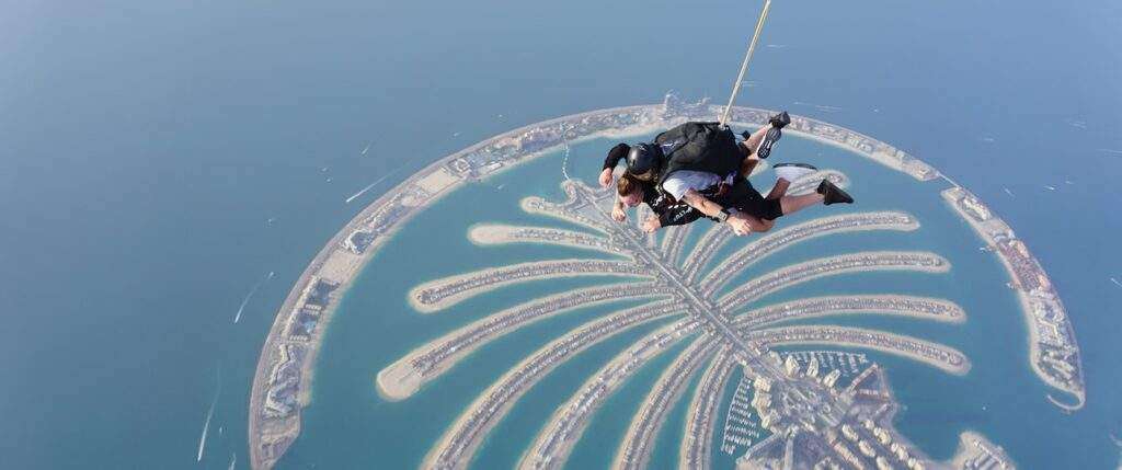 Two skydivers freefalling through the sky