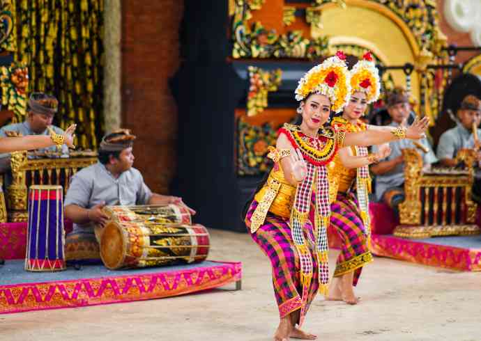 "Two women performing traditional dance at Taman Ayun Royal Family Temple