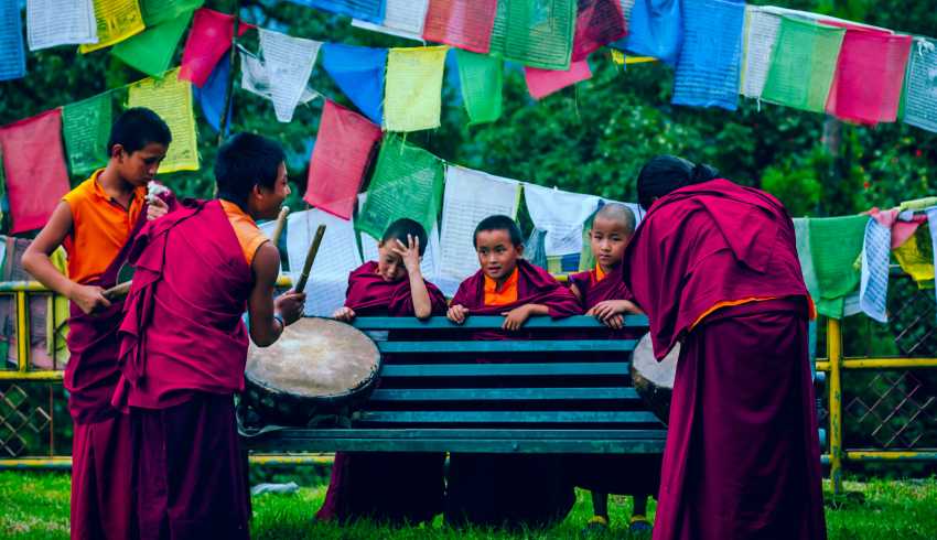 "Bald children dressed as monks in Sikkim were seen joyfully playing drums."