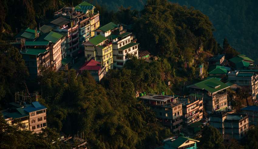 "Nature view of Sikkim with buildings in the morning sunrise"