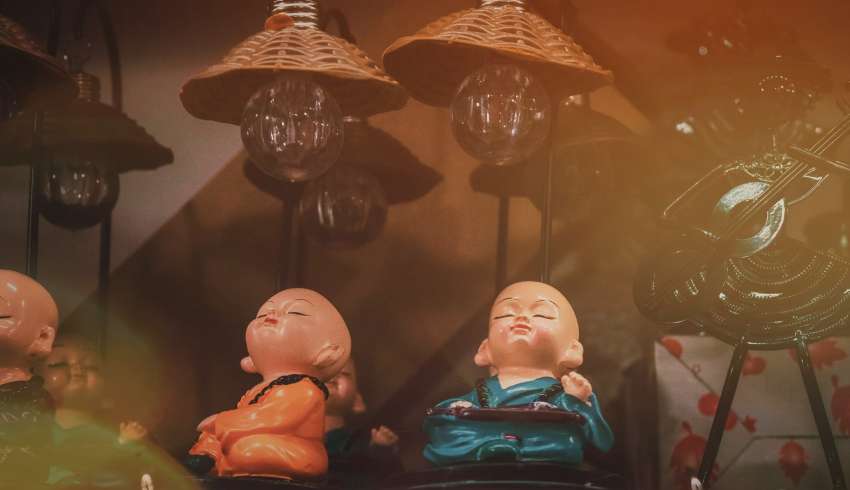 "Colorful Buddhist statues on display in a local market in Sikkim, India"